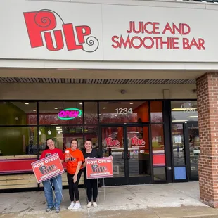 two people holding signs