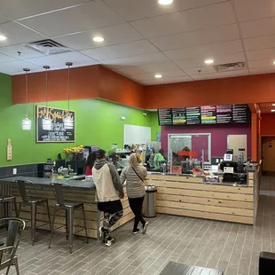 two people sitting at the counter