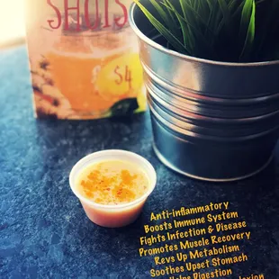 a cup of ginger shots