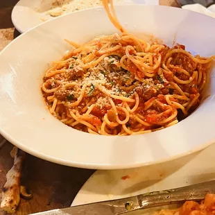 a plate of spaghetti with meat and sauce