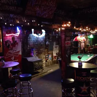 a man playing pool in a pub
