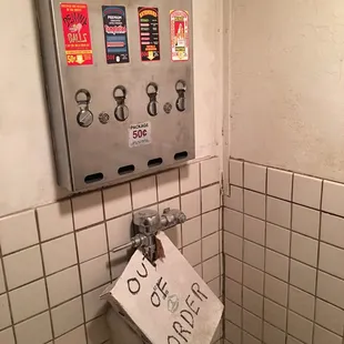 a toilet with a sign on it