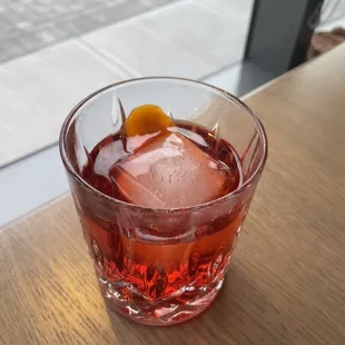 a drink in a glass on a table