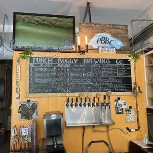 a bar with a chalkboard on the wall