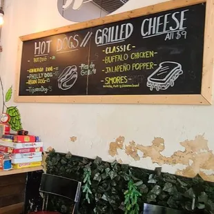a bar with a menu on the wall