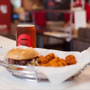 a beer and a basket of food
