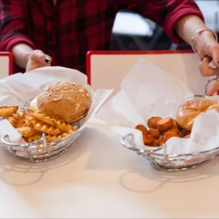 two baskets of food on a table