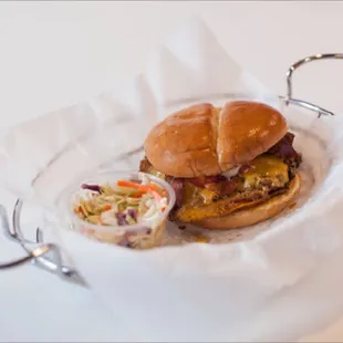 a sandwich and coleslaw in a basket