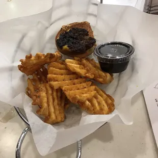 Kids cooked burger smaller than condiment container!