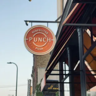 a sign for punch neapolitan pizza