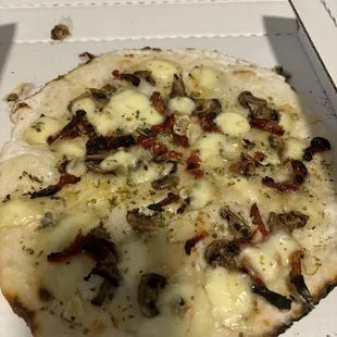 Mushroom something pizza
