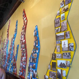 a wall with many different types of pizzas