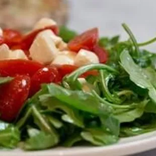 Rocket Salad: Fresh chopped grape tomato and mozzarella on a bed of arugula