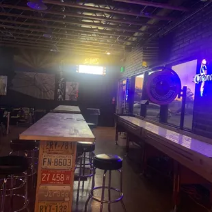 a bar with neon signs