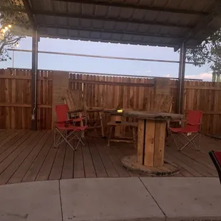 a patio with a table and chairs