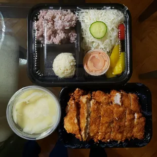 Takeout tonkatsu with brown rice, cabbage, mashed potato and cream soup. Delicious~