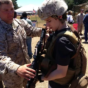 Trying on the military gear.