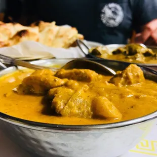 Chicken coconut - boneless chicken cooked w nuts, raisins, exotic herbs &amp; spices in a rich coconut creamy sauce - exxxtra spicy!! Delish!