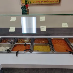 a buffet with a variety of food items