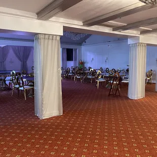 a banquet hall with red carpet
