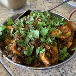 a pan of chicken curry