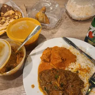 Butter chicken,  curry goat,garlic Naan,  samosa... and 7up. Lpl