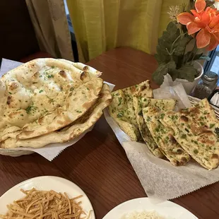 2 orders of garlic naan (left) &amp; 1 order of chili naan (right)