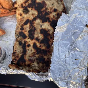 a flatbread and a side of potato wedges