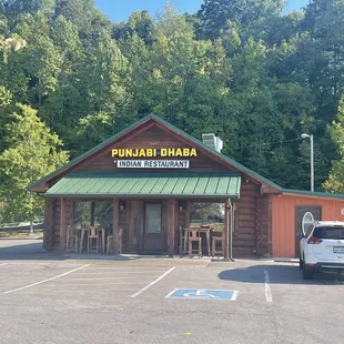 a car parked in front of a restaurant