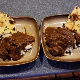 This is a large goat with my rice and a piece of naan. I was licking my plate like a dog.