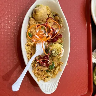 a plate of food on a red tray