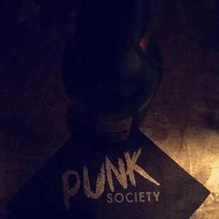 a black fire hydrant on a dark floor