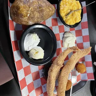 2 piece catfish dinner with baked potato, hush puppies, and mac &amp; cheese
