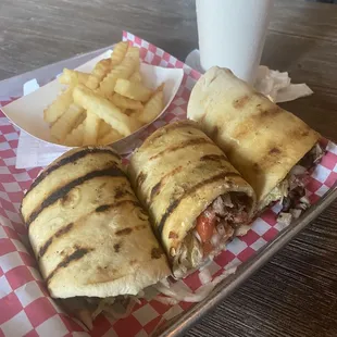 Ribeye steak wrap with fries and drink