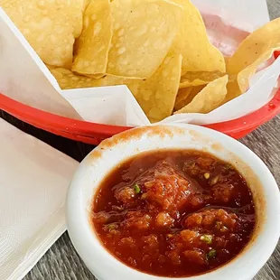 a basket of chips and salsa