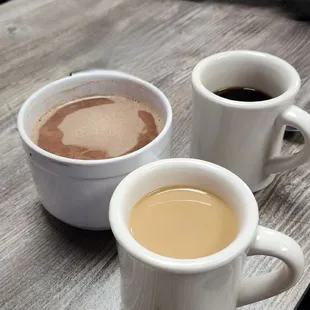 Giant mug of hot chocolate and some regular sized coffees