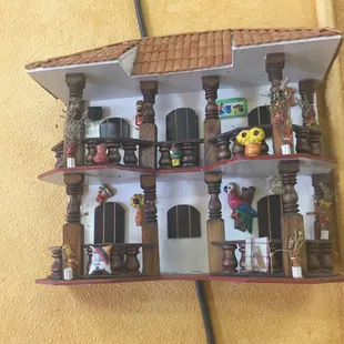 One of the many little house decorations on the walls.