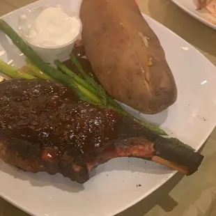 Bone in Pork Chop, Baked Potato and Asparagus