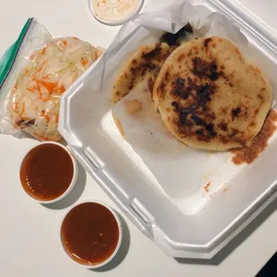 Pupusas with complimentary sauces and cabbage salad