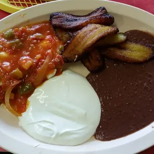 The $6.95 breakfast includes eggs, plantains, beans, cream and tortillas.