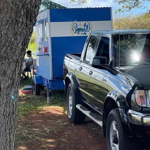 a truck parked next to a trailer