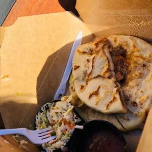 a burrito and coleslaw