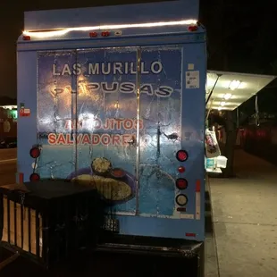 a dog on the back of a bus