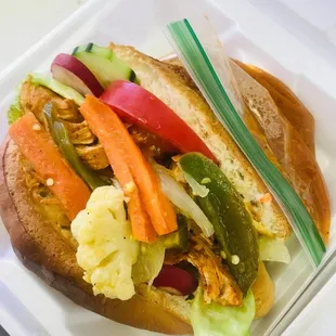 a sandwich in a styrofoam container