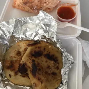 two pieces of bread wrapped in tin foil