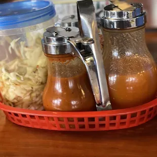 a basket of sauces and condiments