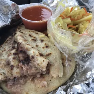 Pupusas: queso con frijoles (cheese with beans) and queso con pollo (cheese with chicken) and slaw and salsa