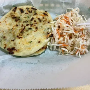 a flat bread and coleslaw