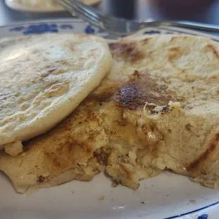 Couldnt wait to take a picture. Revuelta on top, chicharrón con queso tore up on the bottom. Bommmmb!