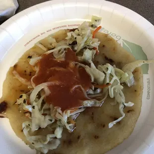 Pork and cheese pupusa with toppings